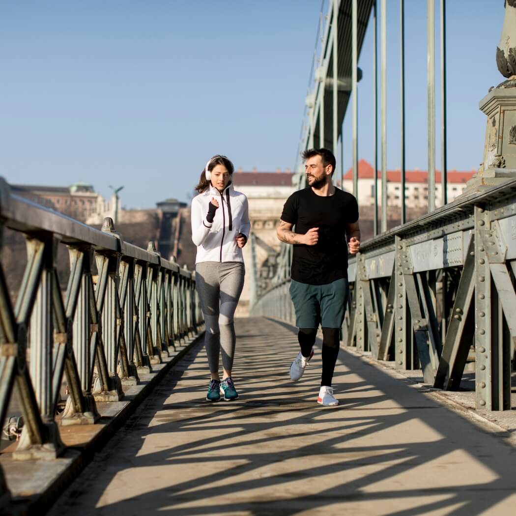 Young urban explorers walking confidently through city streets wearing Laimminis